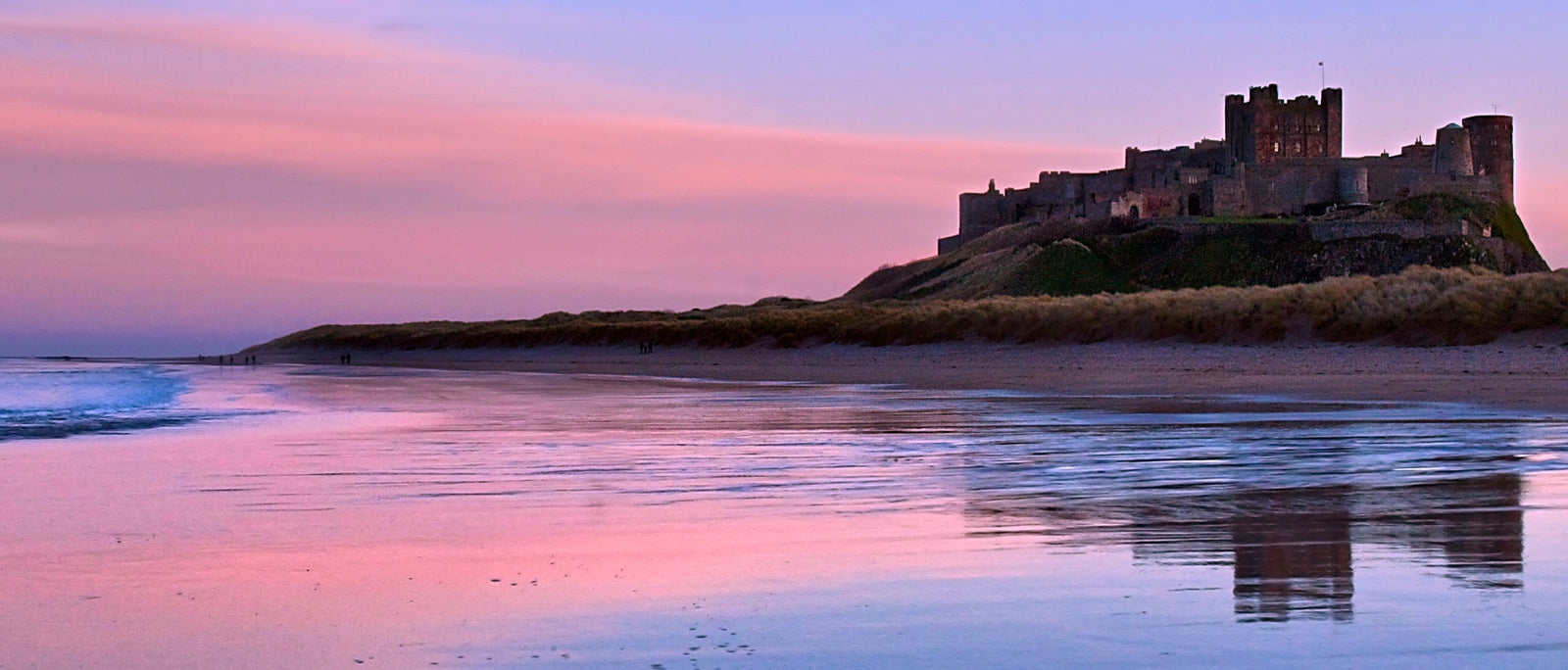 Sunset on Bamburgh Castle, on the Northumberland coast of North East England.