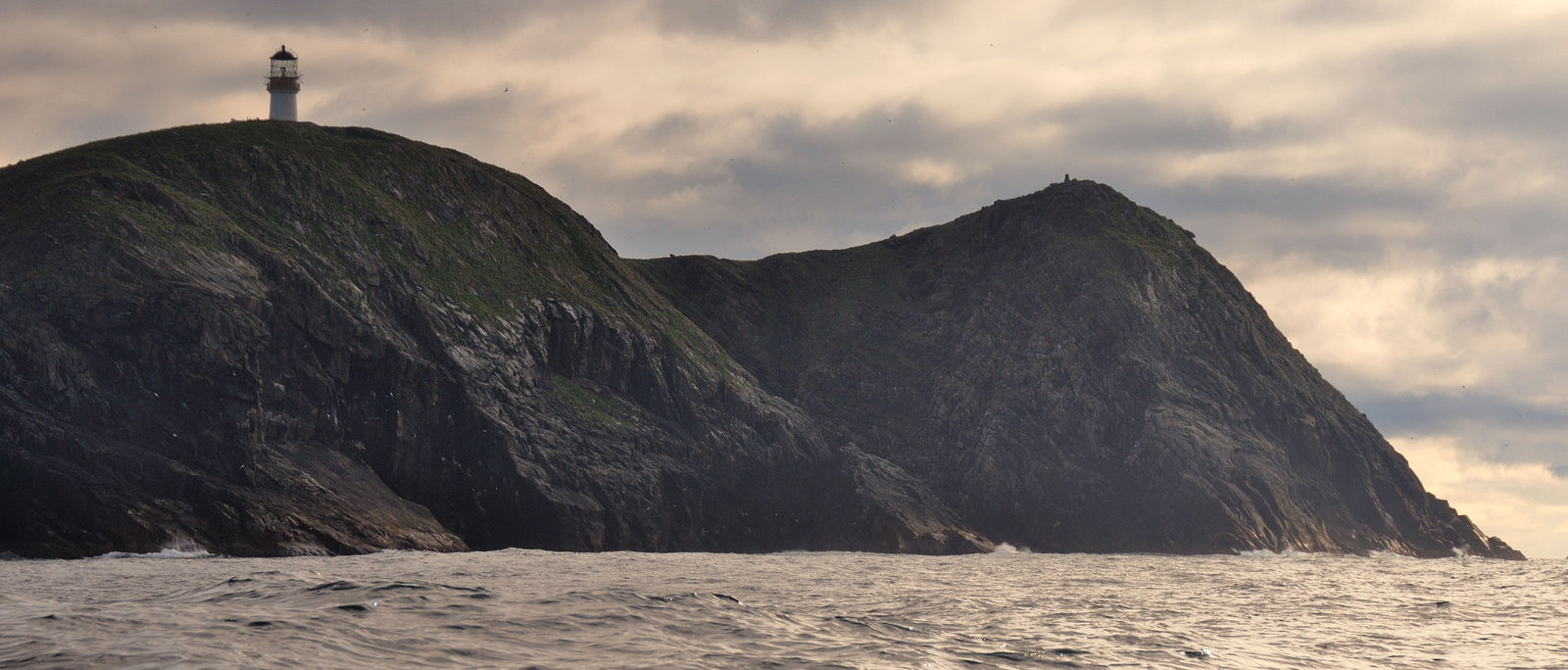 The Flannan Isles Lighthouse is situated 21 miles west of the Isle of Lewis, off the coast of Scotland in the Atlantic Ocean. Image by Ian Cowe via Alamy.